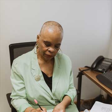 Photo of Joyce A. Williams working at desk