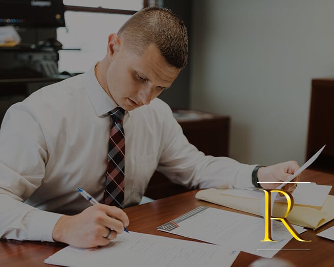 Photo of attorney Russell W. Brown Jr. working at desk